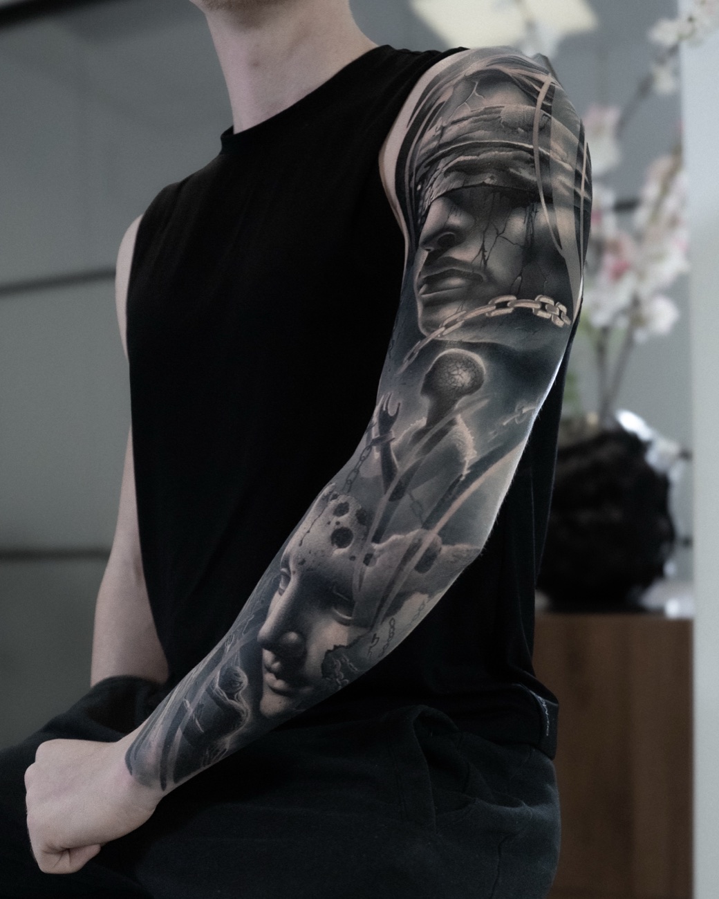 Futuristic black and grey realism sleeve tattoo