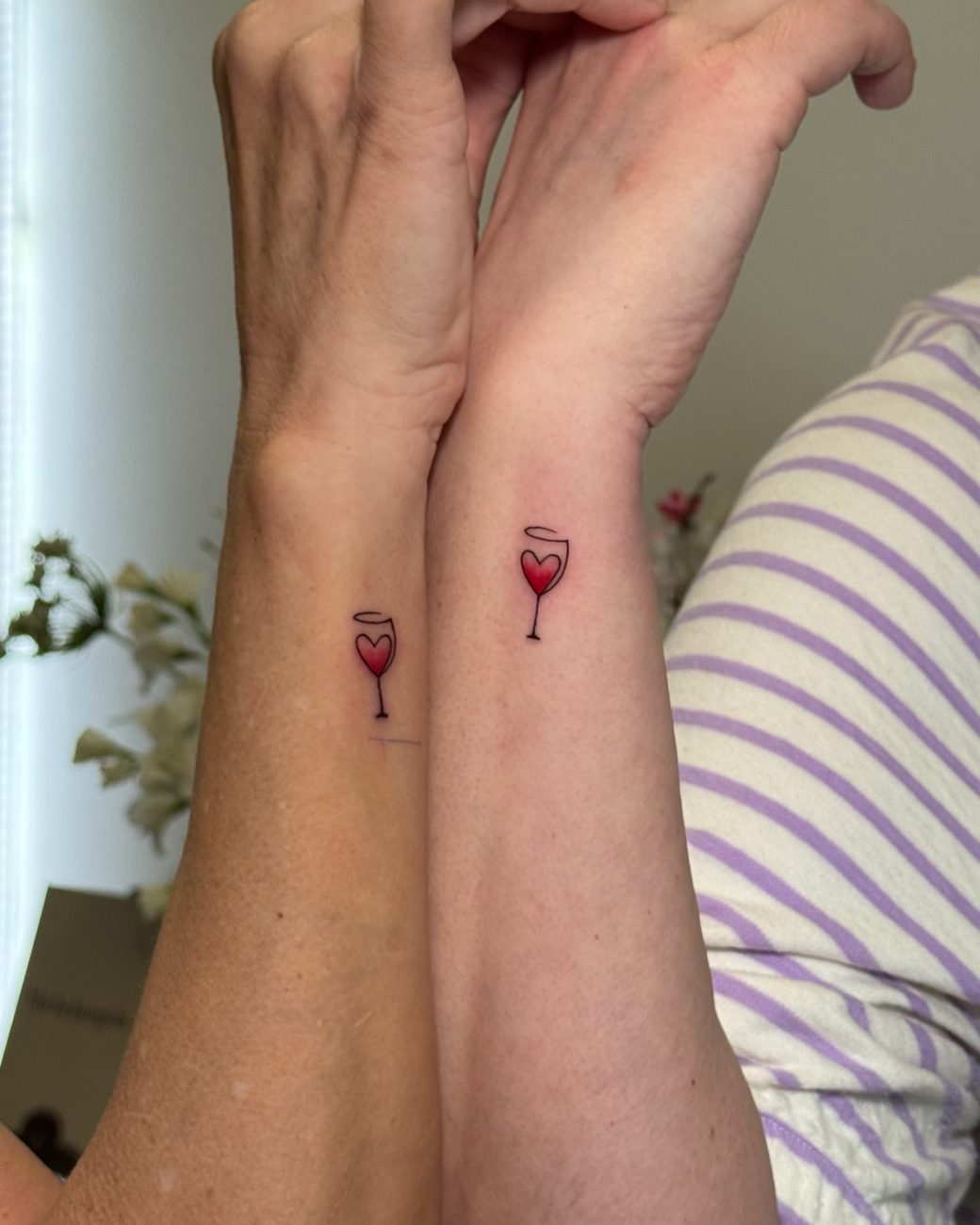 Matching fine line red wine glass tattoos